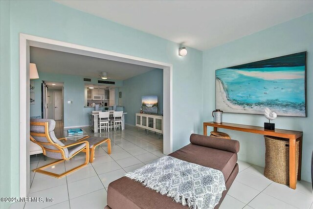 living room with tile patterned floors