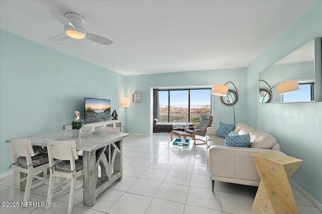 living room with light tile patterned floors and ceiling fan