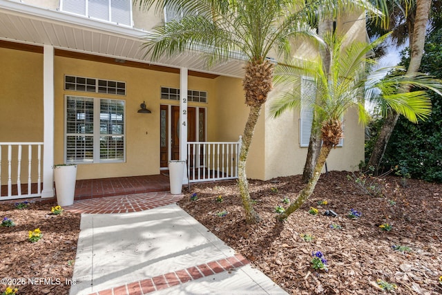 property entrance featuring a porch