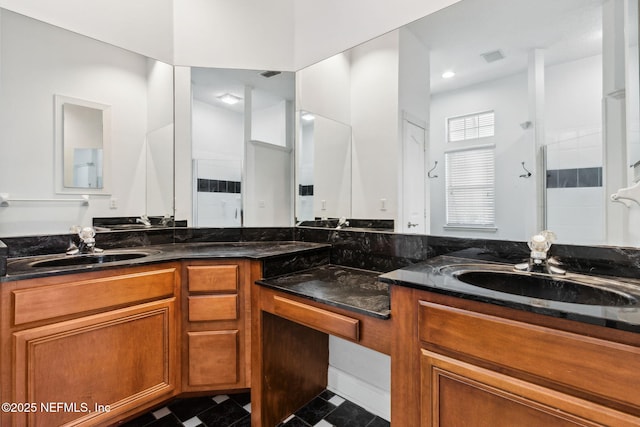 bathroom featuring vanity and walk in shower