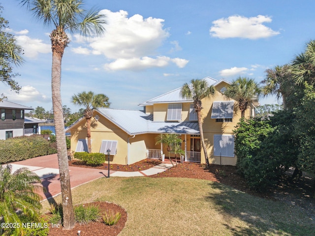 view of front of house featuring a porch and a front lawn