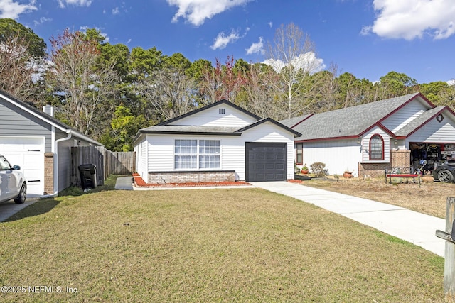 single story home with a garage and a front lawn