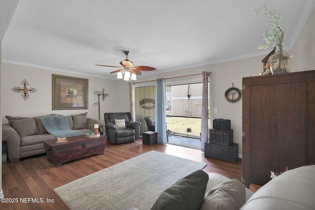 living room featuring crown molding, ceiling fan, and hardwood / wood-style floors