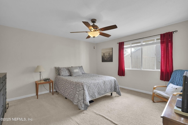 bedroom featuring light carpet and ceiling fan