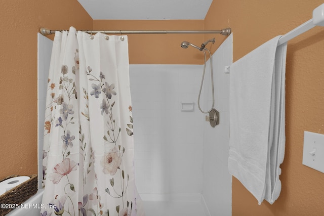 bathroom with a shower with shower curtain