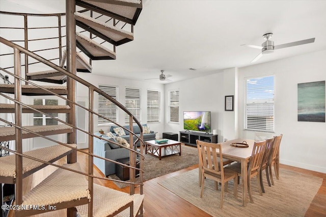 dining area featuring light hardwood / wood-style floors and ceiling fan