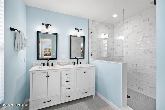 bathroom featuring vanity and a tile shower