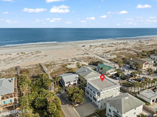 aerial view featuring a view of the beach and a water view