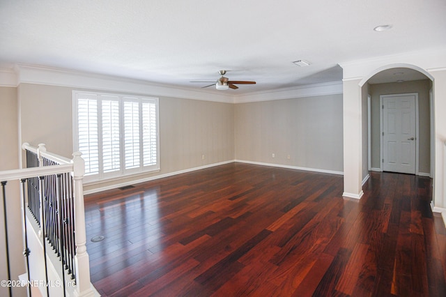 unfurnished room featuring dark hardwood / wood-style flooring, crown molding, and ceiling fan