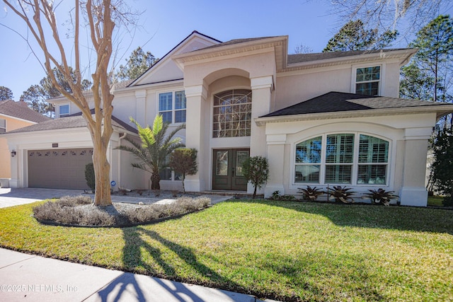 view of front of home featuring a garage and a front lawn