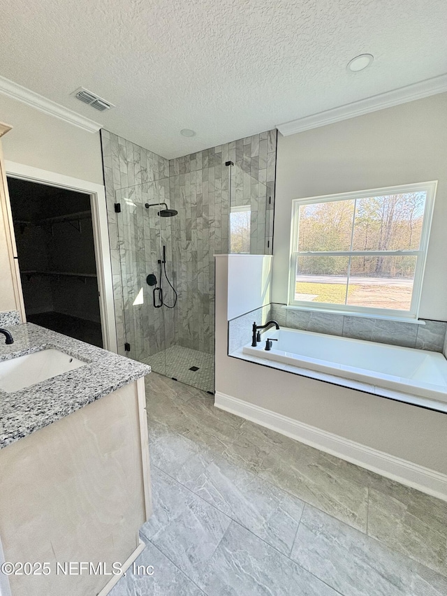 full bath featuring a textured ceiling, visible vents, a garden tub, and a tile shower