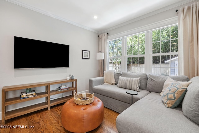 living area featuring ornamental molding, recessed lighting, wood finished floors, and baseboards