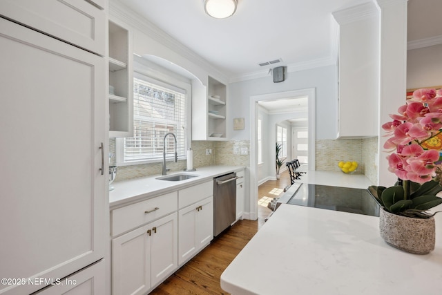 kitchen with crown molding, a sink, stainless steel dishwasher, and open shelves