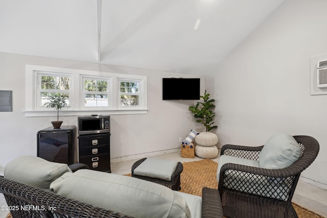 living area with lofted ceiling, a wall unit AC, electric panel, and baseboards