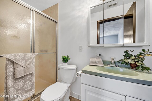 1019 Haynes Ct, Green Cove Springs, FL 32043 - bathroom featuring an enclosed shower, vanity, and toilet