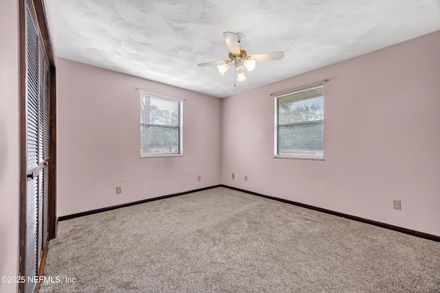 1019 Haynes Ct, Green Cove Springs, FL 32043 - empty room featuring a wealth of natural light, light colored carpet, and ceiling fan
