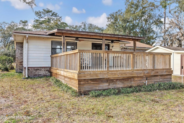1019 Haynes Ct, Green Cove Springs, FL 32043 - rear view of property featuring a wooden deck, ceiling fan, and a lawn