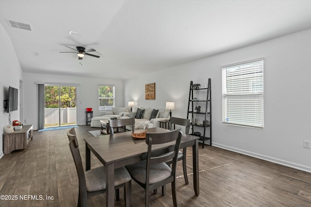 dining room featuring dark wood-type flooring and ceiling fan