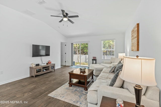 living room featuring dark hardwood / wood-style flooring, vaulted ceiling, and ceiling fan