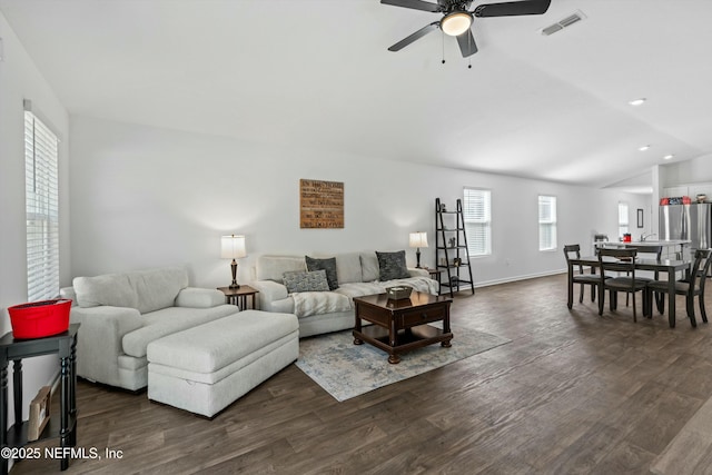 living room featuring vaulted ceiling, ceiling fan, and dark hardwood / wood-style flooring