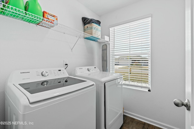 laundry room featuring dark wood-type flooring and independent washer and dryer