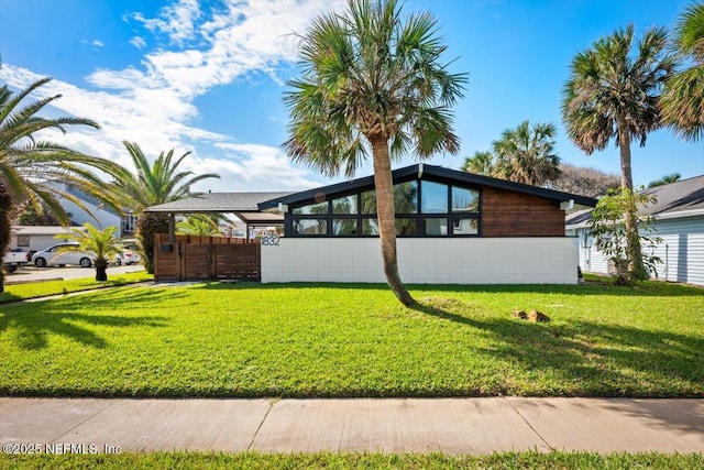 view of property exterior with a lawn