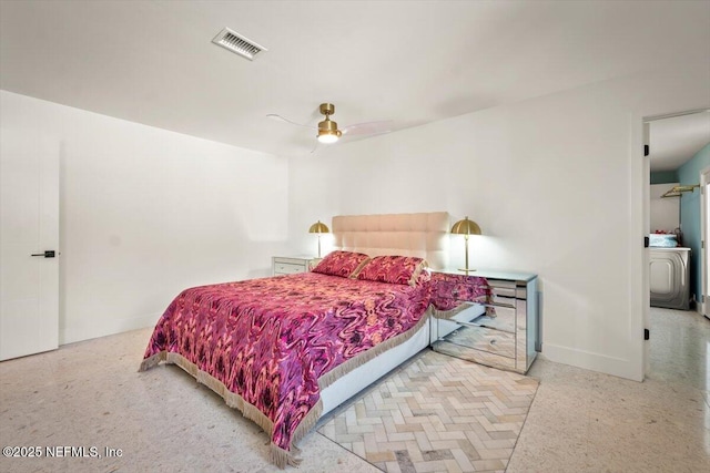 bedroom featuring ceiling fan and washer / clothes dryer