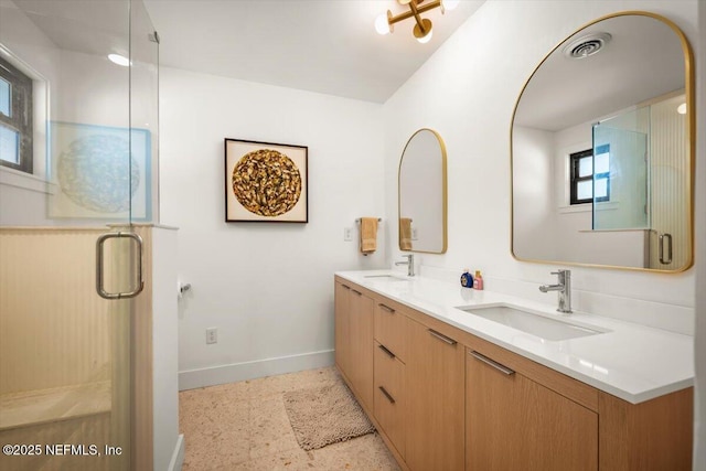 bathroom featuring walk in shower and vanity