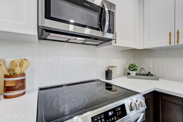 kitchen featuring white cabinetry and stainless steel appliances