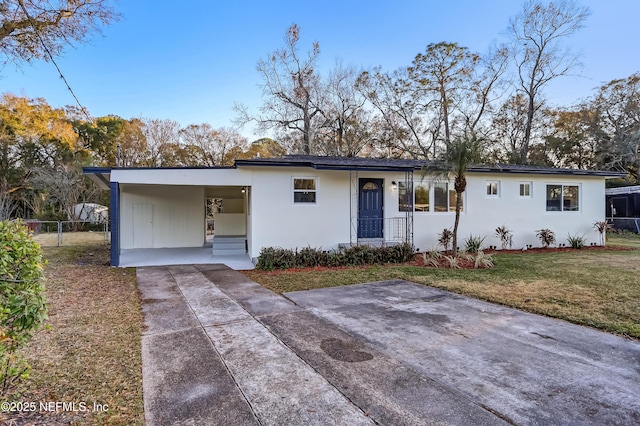 single story home with a carport and a front lawn