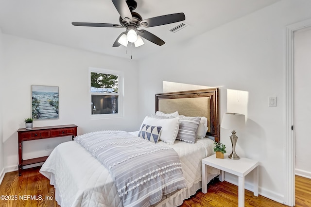 bedroom featuring wood-type flooring and ceiling fan