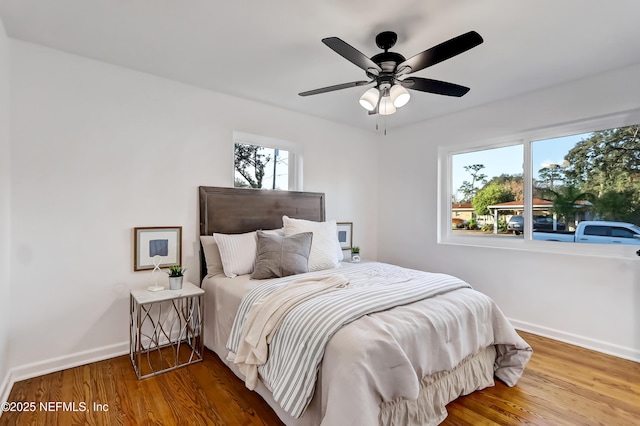 bedroom featuring wood-type flooring and ceiling fan