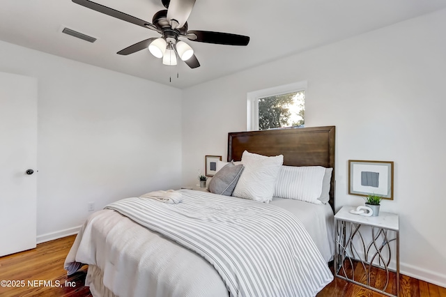 bedroom featuring hardwood / wood-style floors and ceiling fan