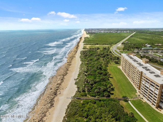 birds eye view of property featuring a view of the beach and a water view