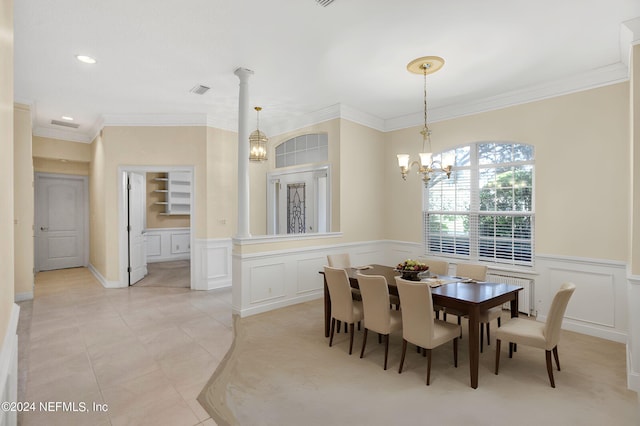 dining space with ornamental molding, wainscoting, a notable chandelier, and radiator heating unit