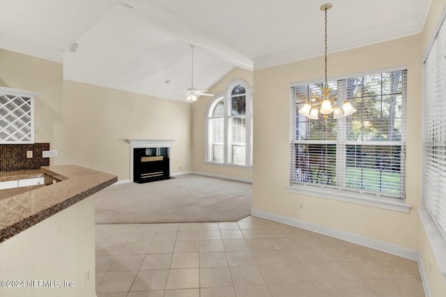 interior space featuring vaulted ceiling with beams, light tile patterned flooring, light carpet, ceiling fan with notable chandelier, and a fireplace with flush hearth