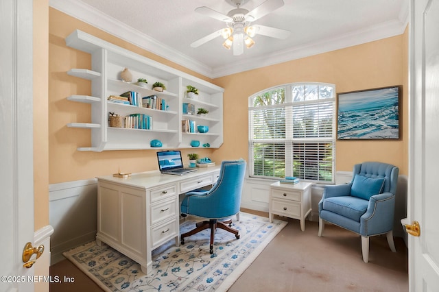 office featuring ornamental molding, a ceiling fan, and light colored carpet