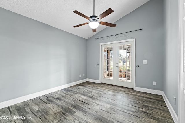 unfurnished room featuring french doors, dark wood-type flooring, vaulted ceiling, a textured ceiling, and ceiling fan