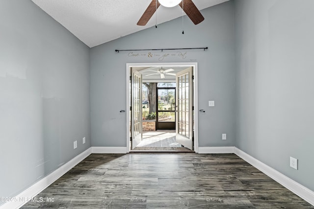 foyer with dark hardwood / wood-style flooring, a textured ceiling, vaulted ceiling, and ceiling fan