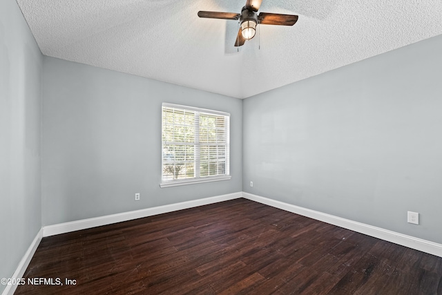 unfurnished room with ceiling fan, dark wood-type flooring, and a textured ceiling