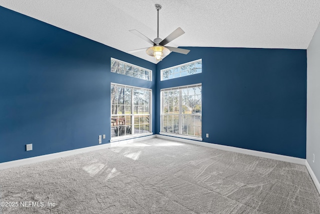 carpeted spare room with a textured ceiling, high vaulted ceiling, and ceiling fan