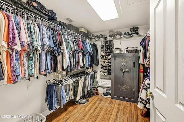 walk in closet featuring wood-type flooring