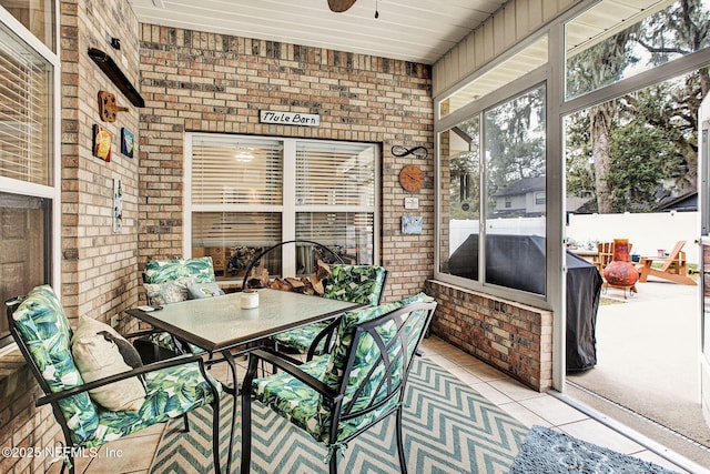 sunroom / solarium with ceiling fan