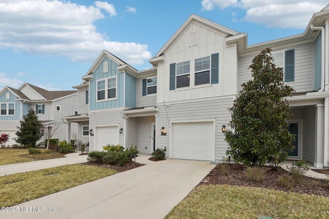 multi unit property with a garage and a front yard