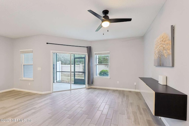 empty room featuring ceiling fan and light hardwood / wood-style flooring