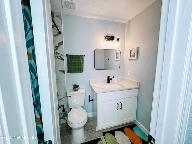 bathroom with toilet, a textured ceiling, vanity, a shower with shower curtain, and hardwood / wood-style floors