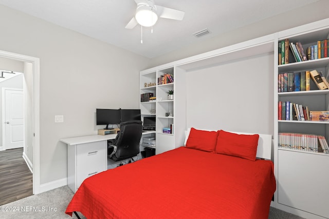 bedroom featuring ceiling fan and carpet