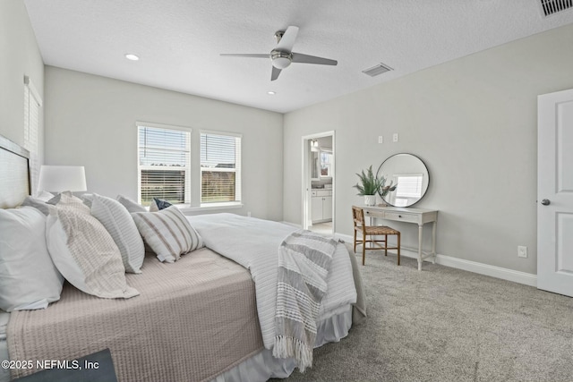 bedroom featuring connected bathroom, ceiling fan, carpet floors, and a textured ceiling