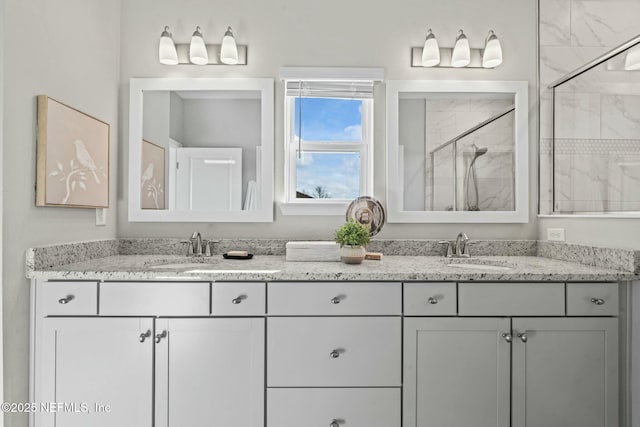 bathroom with an enclosed shower and vanity