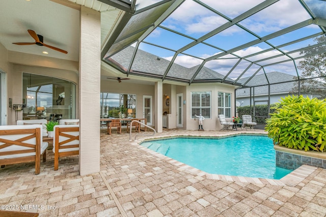 2095 Crown Dr, Saint Augustine, FL 32092 - pool with glass enclosure, ceiling fan, outdoor dining area, and a patio